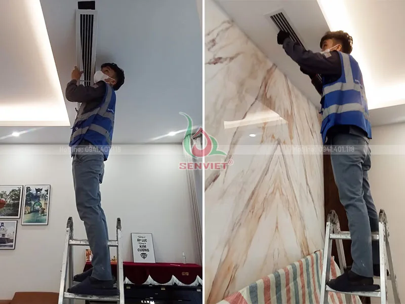 Kỹ thuật viên đang lắp đặt dàn lạnh âm trần Kỹ thuật viên đang lắp đặt dàn lạnh âm trần